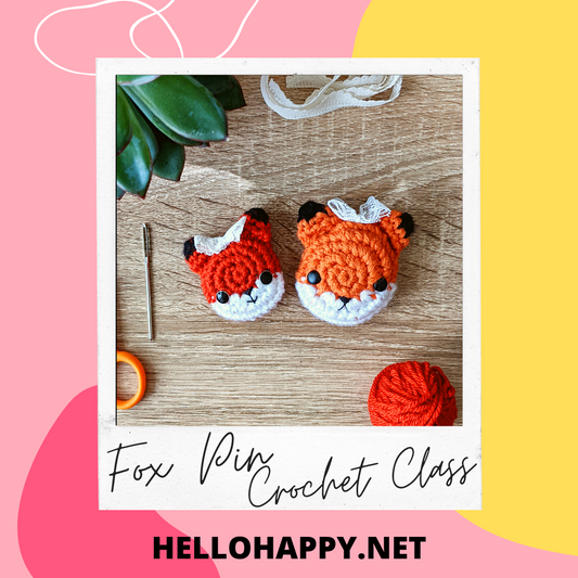 two crochet fox pins, on a wood background, advertising a crochet class